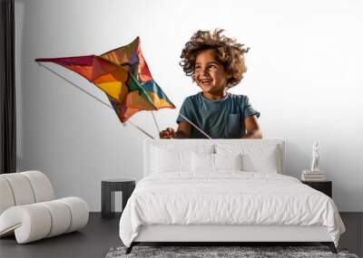 A young boy holds a colorful kite on a white background Wall mural