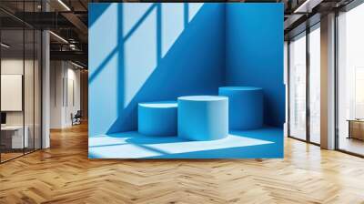 Modern Composition of Blue Podiums: A modern artistic composition featuring three blue podiums under soft lighting and shadows, creating an elegant and minimalistic display space. Wall mural