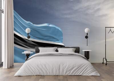 Botswana national flag cloth fabric waving on beautiful grey sky Background. Wall mural