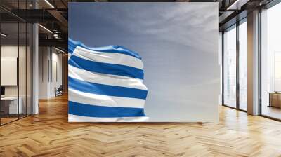 Greece national flag cloth fabric waving on beautiful grey sky Background. Wall mural