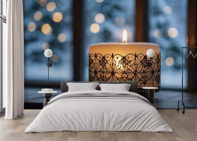 Aesthetic preparation of decorative white candle on a snowy window Christmas themed background. bokeh style. Wall mural