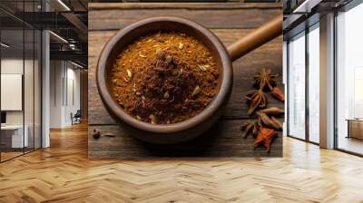 top view of garam masala in a small wooden plate isola background Wall mural