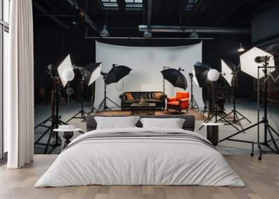 Photo studio with lighting equipment and a couch  Wall mural