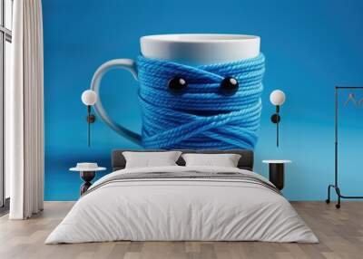 A creatively designed mug wrapped in blue rope on a vibrant blue background, representing Blue Monday cheer Wall mural