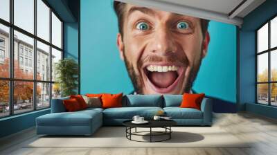 Portrait shocked businessman looking at camera blue background. In shirt and necktie. Young adult facial expression shock, fear, and surprise. Studio indoors. Business emotion gesturing. Wall mural