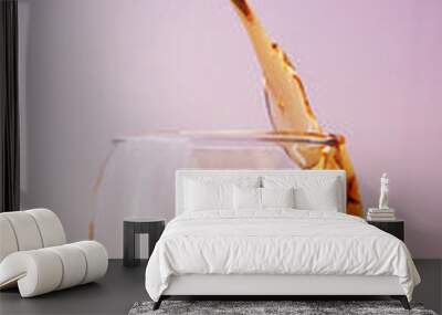 Glass with alcoholic beverage and splashes with liquid drop Wall mural