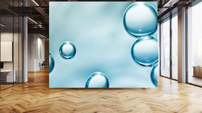 transparent gas bubbles on water surface. Worms-eye low angle with crystal bubbles in purified water on blue background. cosmetic background with copy space Wall mural