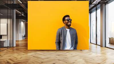 portrait of a man against a yellow background Wall mural