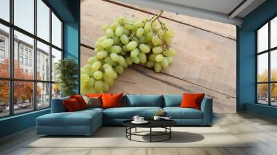 Green grapes on a wooden table Wall mural