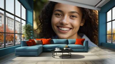 A happy young woman of mixed race at the garden Wall mural