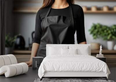 A woman model wearing a blank black apron mockup Wall mural