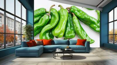 Flat lay green chili peppers over a white background Wall mural