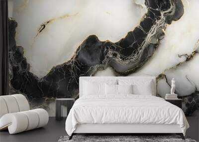 A close-up of a black and white marble surface with intricate patterns and textures. Wall mural