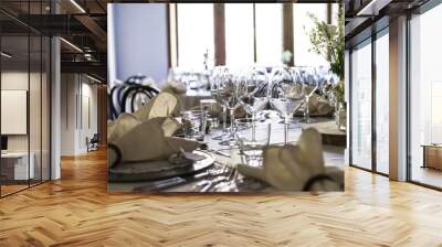 Decorated table on a wedding with wine glasses and blurred out background Wall mural