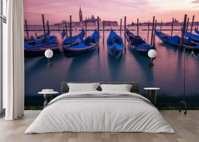 Gondolas and gondolier in lagoon of Venice by Saint Mark (San Marco) square with San Giorgio di Maggiore church in background in Venice Wall mural