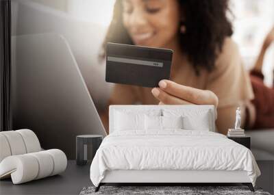 Hand, credit card and online shopping with a black woman customer using her laptop in the living room. Finance, computer and accounting with a female consumer spending money through ecommerce Wall mural