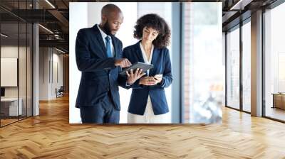 Black people, tablet and checking data, schedule or digital marketing in corporate networking at the office. Employee man and woman with touchscreen in planning for business idea or market strategy Wall mural