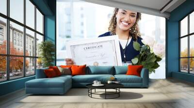 Certificate, flowers and portrait with a black woman graduate in the hospital, proud of her achievement. Smile, graduation and qualification with a happy young female nurse standing alone in a clinic Wall mural