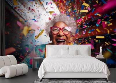 Happy laughing woman with falling confetti. Birthday, New Year, fun celebration party Wall mural