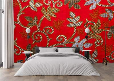 A traditional Indonesian Batik fabric with flowers motif, red color Wall mural