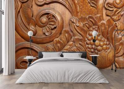 Texture of wooden door with carved motifs for background Wall mural