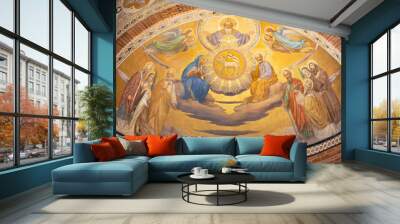 PAVIA, ITALY - SEPTEMBER 9, 2024: The fresco of Holy Trinity among the saints in the main apse of church Chiesa di San Teodoro. Wall mural