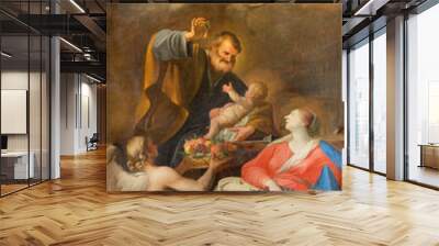 vienna, austira - juli 5, 2021: the painting of holy family in the church jeusitenkirche by andrea p Wall mural