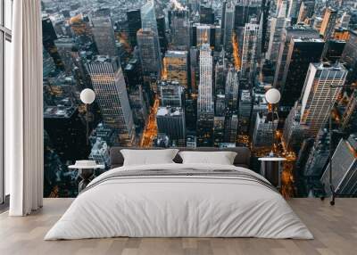 Aerial view of illuminated skyscrapers in a dense urban city at dusk Wall mural