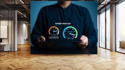 Fast internet connection speed test. A man uses a tablet to check the bandwidth of wireless networking or 5G cellular Mbps or Gbps speed quality. Wi-Fi 7 network download or upload transfer rate. Wall mural