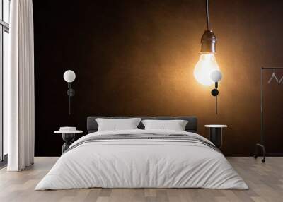 Brightness tungsten light bulb hanging at dark room Wall mural