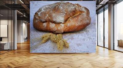 Some bread and a bunch of yellow wheat spikes  Wall mural