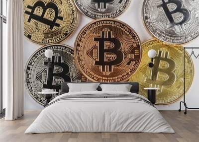 Closeup of six gold, silver, and bronze Bitcoin cryptocurrency coins on a white background. Wall mural