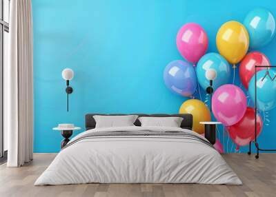 Colorful balloons on a blue background, with space for text. Wall mural