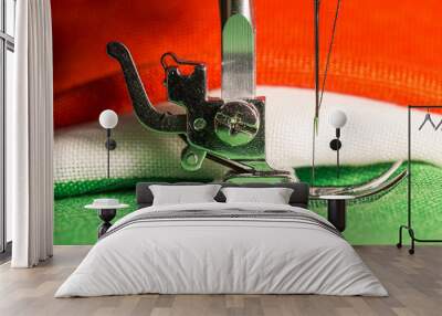 Detail of the leg of a sewing machine, with tricolor cloth of the Italian flag Wall mural