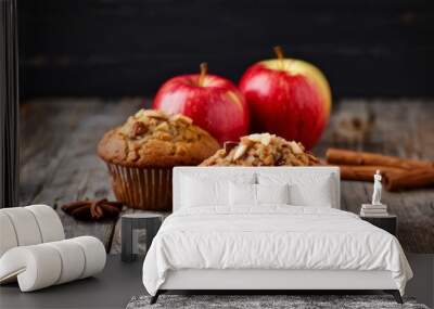 Two Apple Muffins with Cinnamon Sticks and Apples on a Wooden Table Wall mural