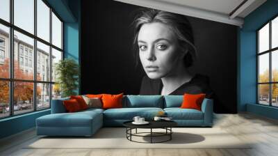 Dramatic black and white portrait of a beautiful woman on a dark background Wall mural