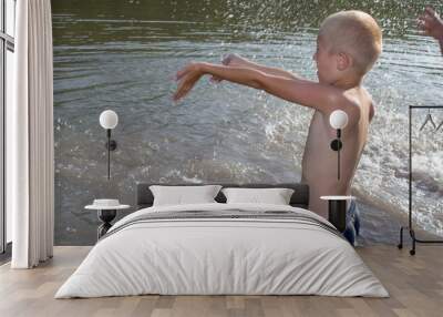 boy splashing water in the lake Wall mural