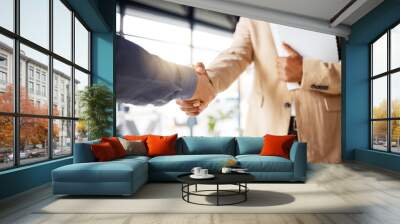 Handshake, contract deal and business partnership of a b2b meeting with shaking hands. Networking, hiring and professional negotiation of onboarding collaboration and congratulations of project Wall mural