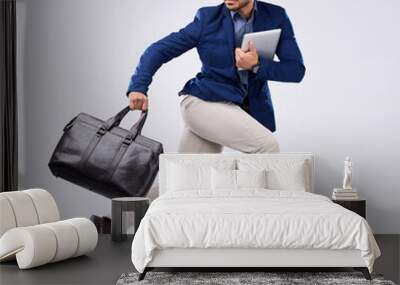 Hurry, work and an Asian man jumping for business isolated on a white background in a studio. Fast, serious and a corporate Japanese businessman running in the air while late to the workplace Wall mural