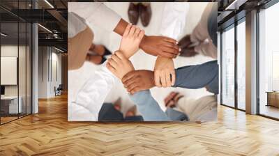 Team, business people and holding hands for work community, support and teamwork. Team building, diversity and group collaboration motivation of corporate employees with solidarity and hope together Wall mural