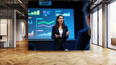 Confident Indian Female Executive Leading Presentation with Interactive Data Visuals Wall mural