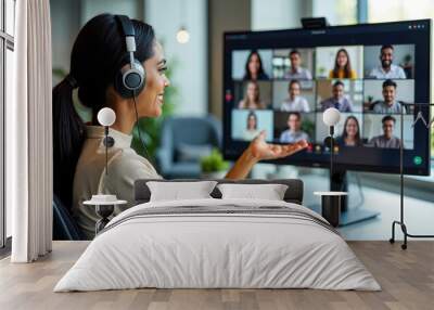 Professional Indian Female Conducting a Remote Team Video Conference Wall mural