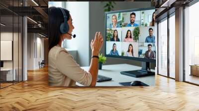 Professional Indian Female Conducting a Remote Team Video Conference Wall mural