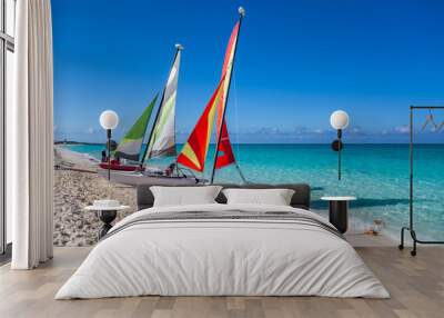 Two sailing catamarans on the beach Wall mural