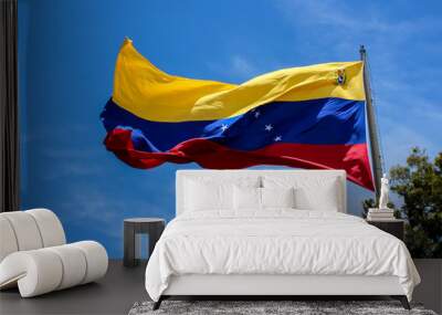 venezuela flag waving in the wind, blue sky cleared. Wall mural