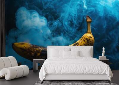 A single banana with blue smoke and dark spots. Wall mural