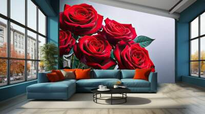 Red roses in closeup with copy space on the right, set against a light grey backdrop Wall mural