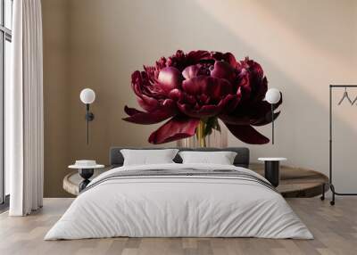 Purple peonies bloom in a vase which is used as decoration in the house. Wall mural