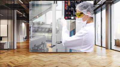 Young Women Operating The Control Panel Wall mural