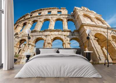 Architectural fragment of ancient roman amphitheatre in Pula city in Croatia. Wall mural